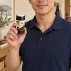 Person holding KAFX Coffee Shop deodorant in an everyday setting